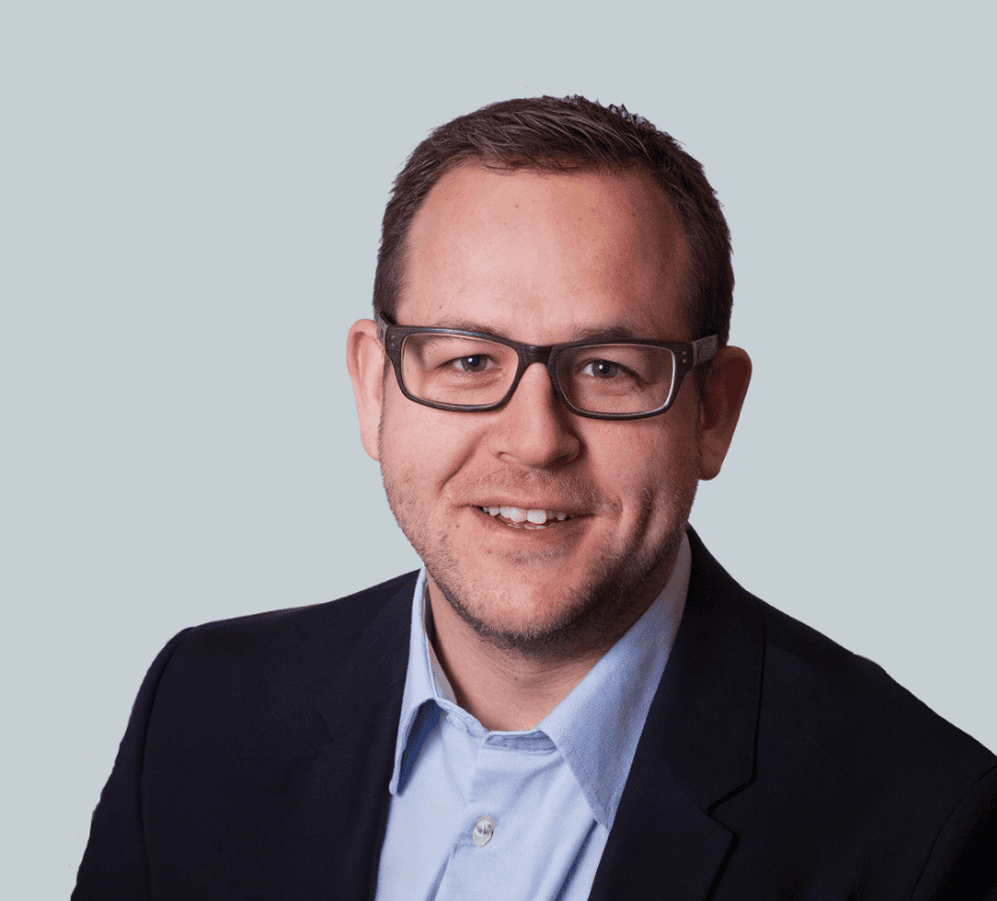 Portrait of Kilian Wölfle, IT expert at Accompio, in professional attire.