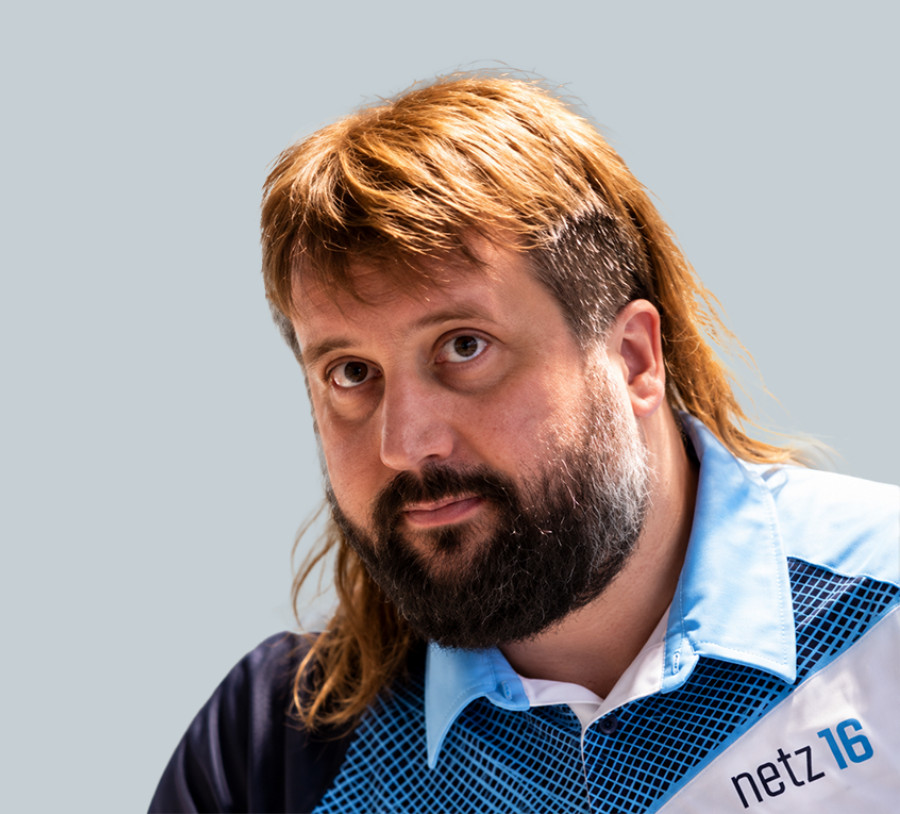 Man wearing an IT services shirt, professional networking solution.